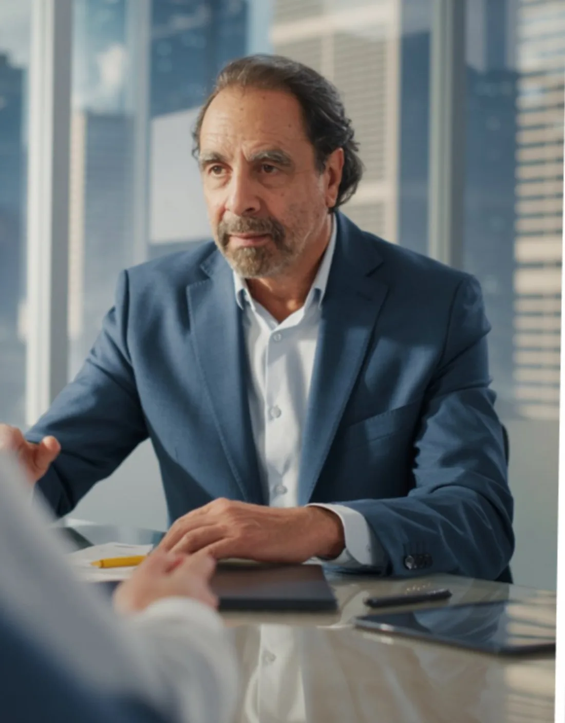 Juan Pablo Ochoa in a high-rise meeting room